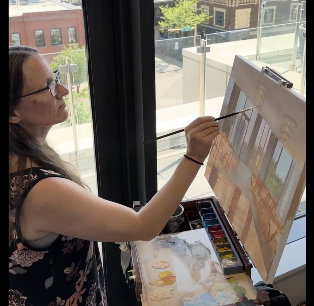 Shanna Cramer painting at a wedding